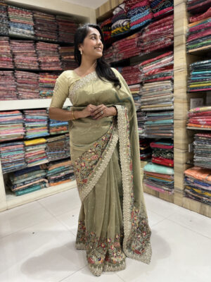 elegant olive green embroidered saree with lace border