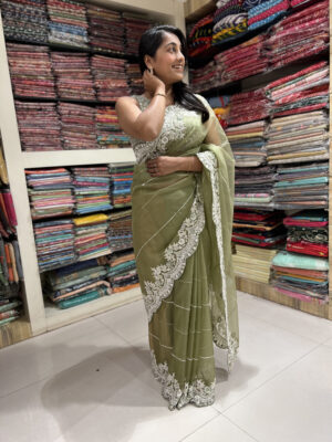 olive green sheer saree with white embroidered border